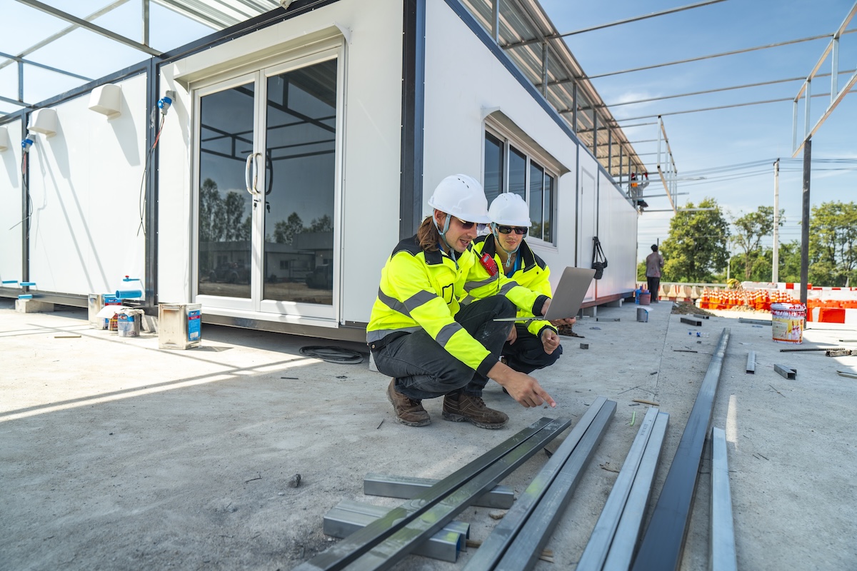 two-engineers-in-high-visibility-jackets-and-helme-2026-01-09-10-37-21-utc